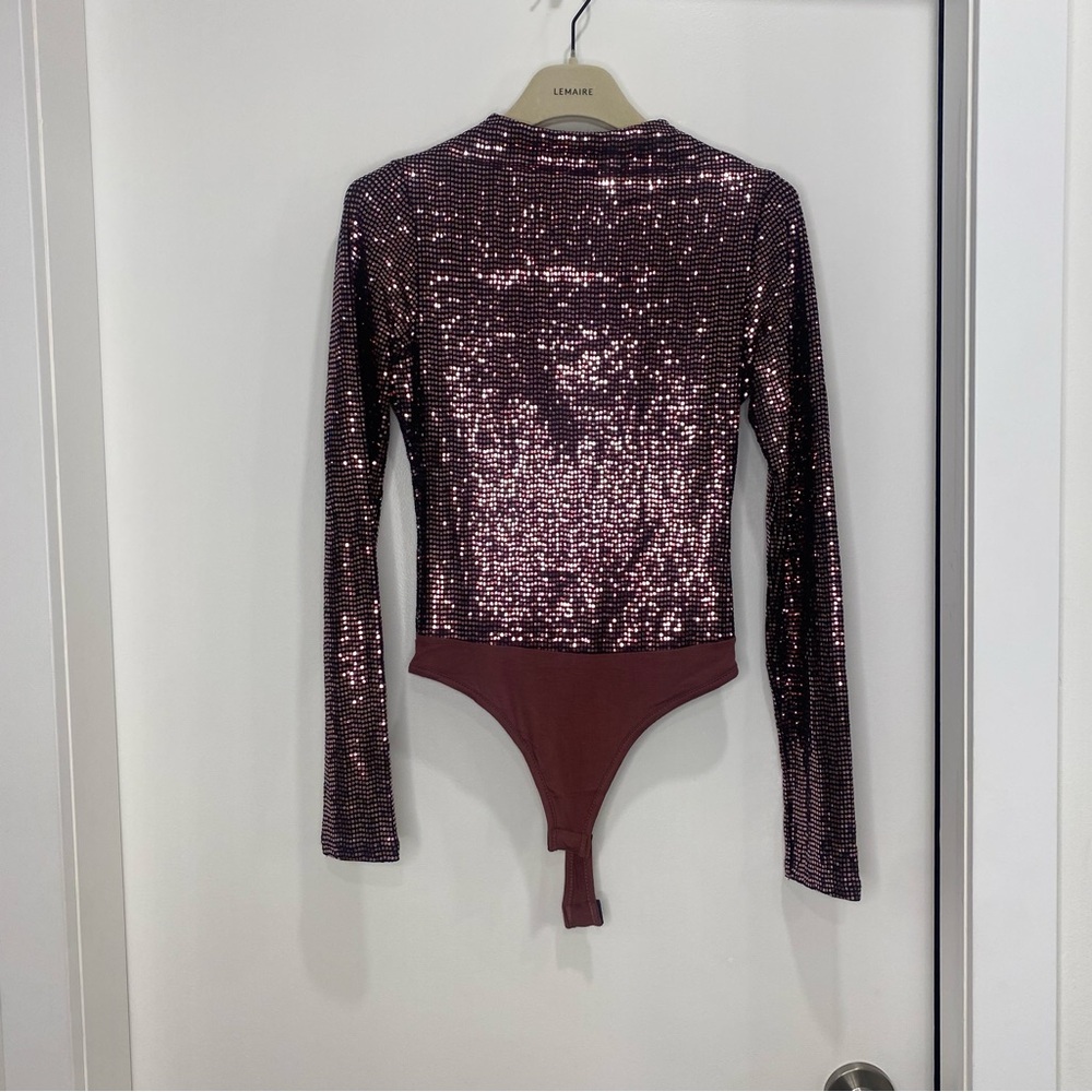 shiny purple body suit